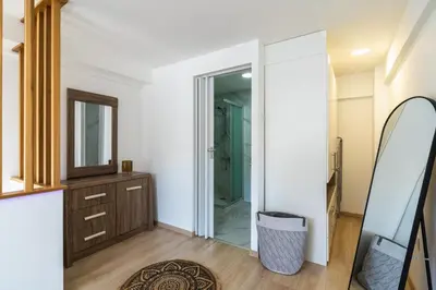 a bathroom with a mirror and a dresser at Tangerine Modern 1-BR Apartment in Larnaca in Larnaka