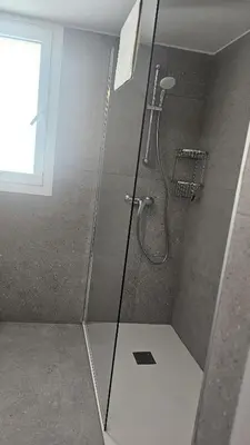 a shower with a glass door in a bathroom at STAY Hydra Comfort Apartment in Nicosia