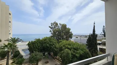 a view of the ocean from the balcony of a building at STAY Sea Gate Apartment in Larnaka