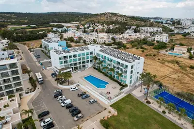an aerial view of a building with a parking lot at Crystal Coast in Protaras