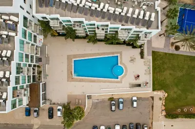 an overhead view of a building with a swimming pool at Crystal Coast in Protaras