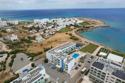 an aerial view of a city and the ocean at Crystal Coast in Protaras