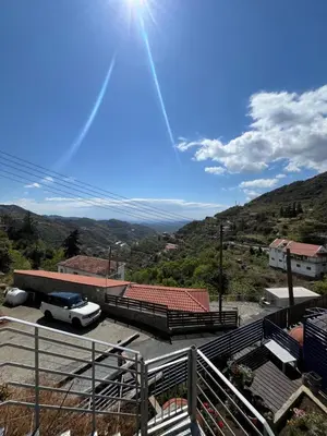 a truck parked in a parking lot with a view at Odou Residence in Odhou