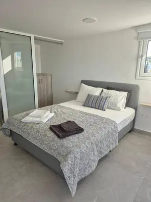 a bedroom with a bed with a tray on it at Konnos Studio in Protaras
