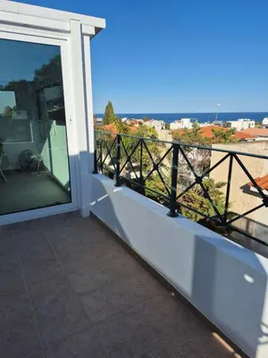 a balcony with a view of the ocean at Konnos Studio in Protaras