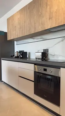 a kitchen with a black and white stove top oven at 201 Lux Suite Tower206 in Lakatamia