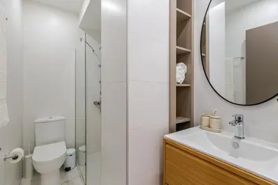 a bathroom with a toilet and a sink and a mirror at Best location in Larnaca 100m from the beach in Larnaka