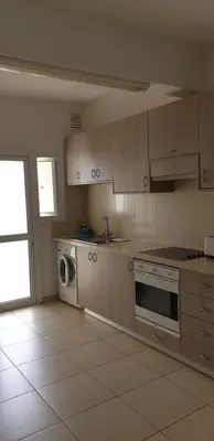 a kitchen with a stove and a dishwasher at Takelena Apartments in Limassol