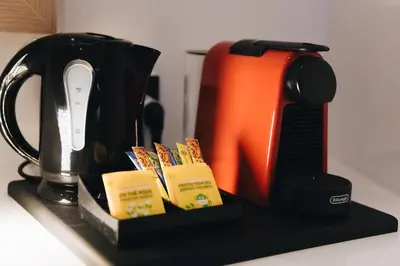 a tea pot and a toaster on a kitchen counter at Kition Urban Suite 3 in Larnaka