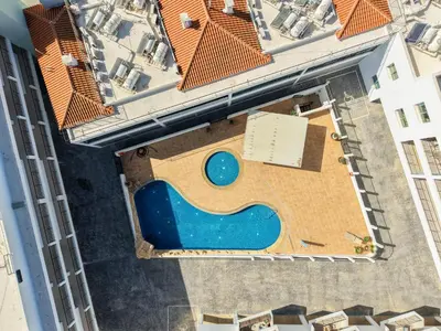 an overhead view of a swimming pool in a building at Chromata Lagoon Sea View Apartment in Paralimni