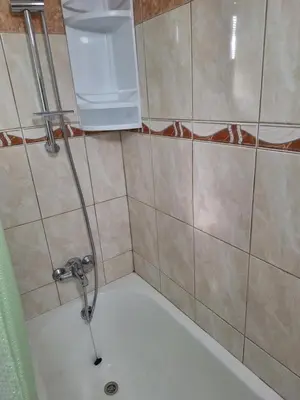a bathroom with a shower with a sink and a tub at Big house in center of protaras, near beach in Protaras