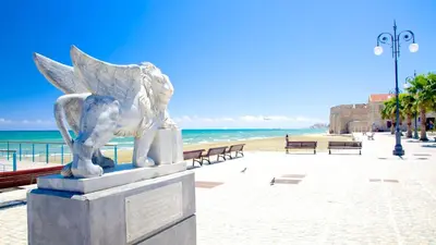 a statue of an angel on the beach at Spacious Larnaca Beach Apartment in Larnaka