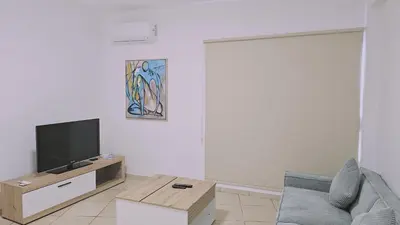 a living room with a tv and a couch at STAY Sunny Honey Apartment in Ayia Napa