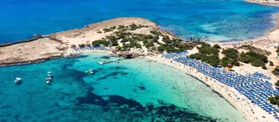 an aerial view of a beach with boats in the water at STAY Sunny Honey Apartment in Ayia Napa