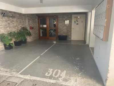an empty parking lot in front of a building at Gorgeous 1 Bedroom apartment close to Town Centre in Limassol