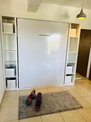 a pair of scissors on a rug in front of a sliding door at Gorgeous 1 Bedroom apartment close to Town Centre in Limassol