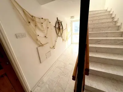 a staircase in a home with white walls at Casa Sea Breeze in Larnaka