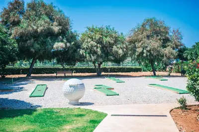 a park with a large vase and green ramps at Cozy apartment at Thalassa Beach Resort, Northern Cyprus in Paralimni