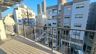 a balcony with a view of some buildings at Kanika 3 bedroom city beach in Limassol