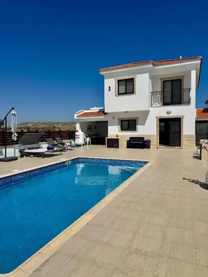 a villa with a swimming pool and a house at Lazuli Zen Villa with Private Pool in Pyla