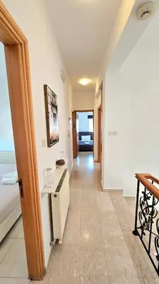 a hallway leading to a room with the ocean at Suburban Family Villa in Limassol