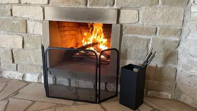 a brick oven with a fire in it at The Hideaway in Arminou