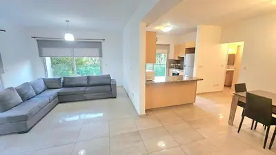 a large living room with a couch and a table at Neapolis city apartment in Limassol