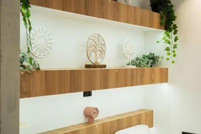 a room with wooden shelves and plants at SuiteNapa22 in Ayia Napa