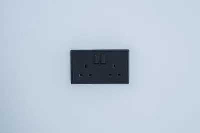 an electrical outlet on a white wall at SuiteNapa22 in Ayia Napa