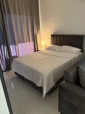 a bedroom with a large bed and a couch at CEASAR RESORT STUDIO Consus in Aglantzia
