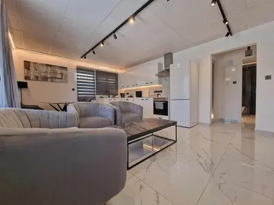 a large living room with couches and a kitchen at Modern House in Touristic Pyla - Oroklini! in Larnaka