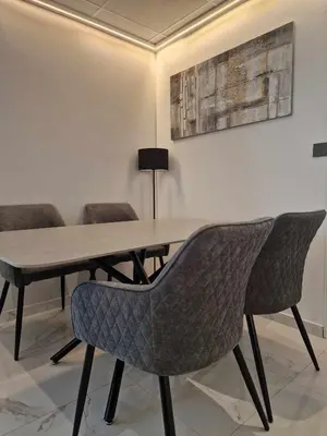a dining room with a table and chairs at Modern House in Touristic Pyla - Oroklini! in Larnaka