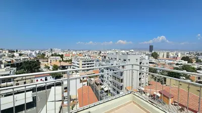 a view of a city from the balcony of a building at Molos city centre living in Limassol