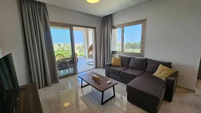 a living room with a couch and a table at Suburban Escape in Limassol