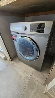 a washing machine is sitting in a room at Suburban Escape in Limassol