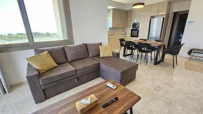 a living room with a couch and a table at Suburban Escape in Limassol