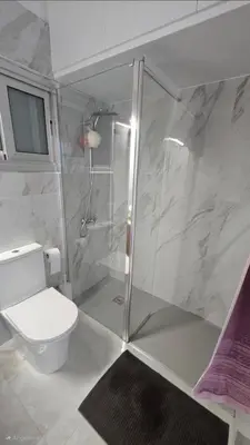 a bathroom with a shower and a toilet in it at Sea Breeze 3 Bed Frontline Flat in Limassol