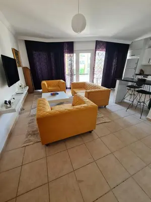a living room with two couches and a table at At Patara Site, the heart of Kyrenia in Aglantzia