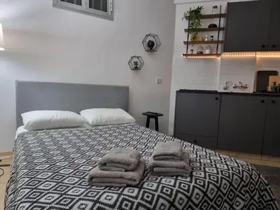 a bedroom with a bed with towels on it at Paradise Garden Sweet Studio in Limassol