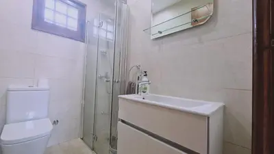 a bathroom with a toilet and a sink and a shower at STAY Villa Michalis in Pissouri