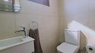 a bathroom with a toilet and a sink at STAY Villa Michalis in Pissouri