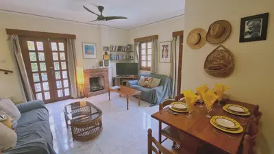 a living room with a table and a couch at STAY Villa Michalis in Pissouri