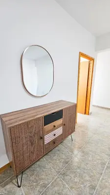 a mirror on top of a dresser in a room at Central City Rooms in Larnaka