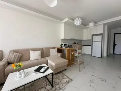 a living room with a couch and a table at Marcellus in Larnaka