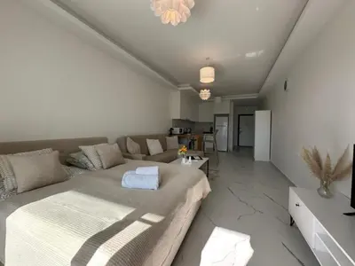 a living room with a couch and a table at Marcellus in Larnaka