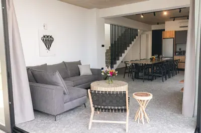 a living room with a couch and a table at Black Diamond Villas Protaras in Protaras