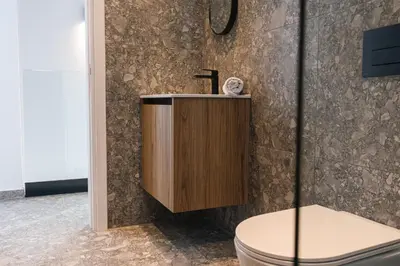 a bathroom with a sink and a toilet at Black Diamond Villas Protaras in Protaras