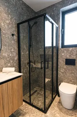 a bathroom with a shower and a toilet at Black Diamond Villas Protaras in Protaras