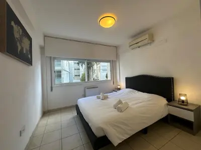 a bedroom with a bed with two pillows on it at 2 bedrooms flat near center in Engomi