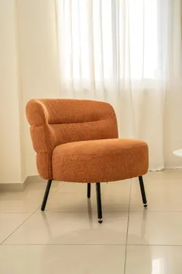 a chair sitting in front of a window at 2 bedroom flat in Nicosia